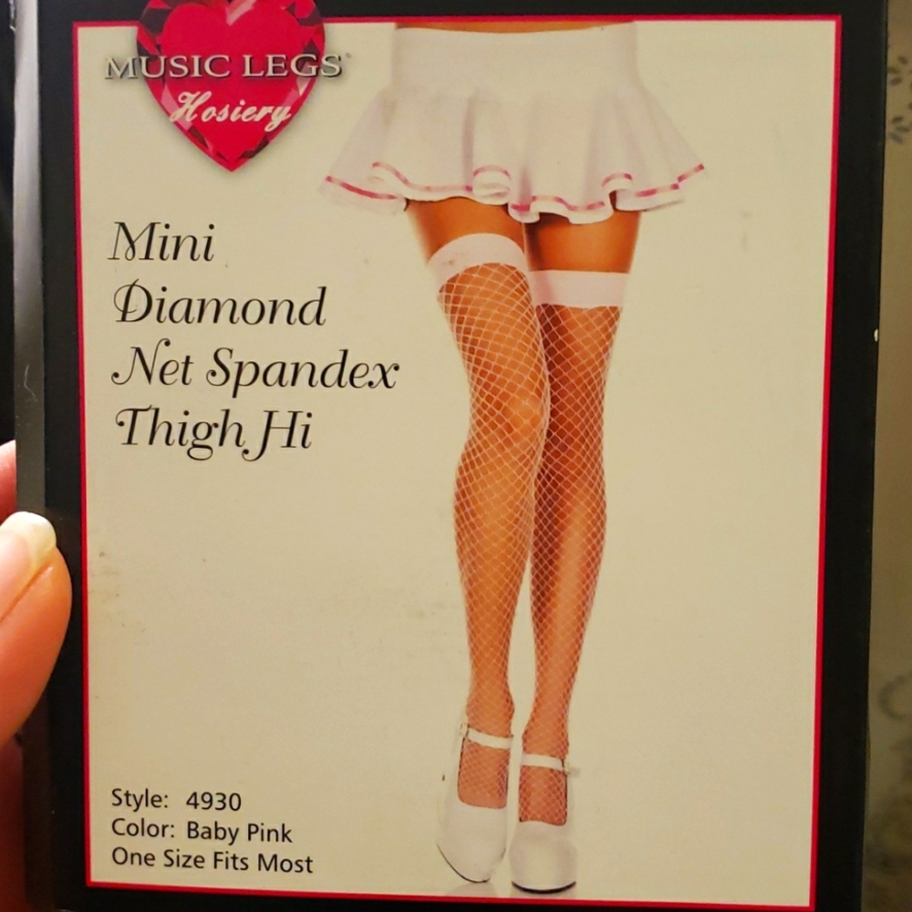 Pink new in package thigh hi fishnet stocking